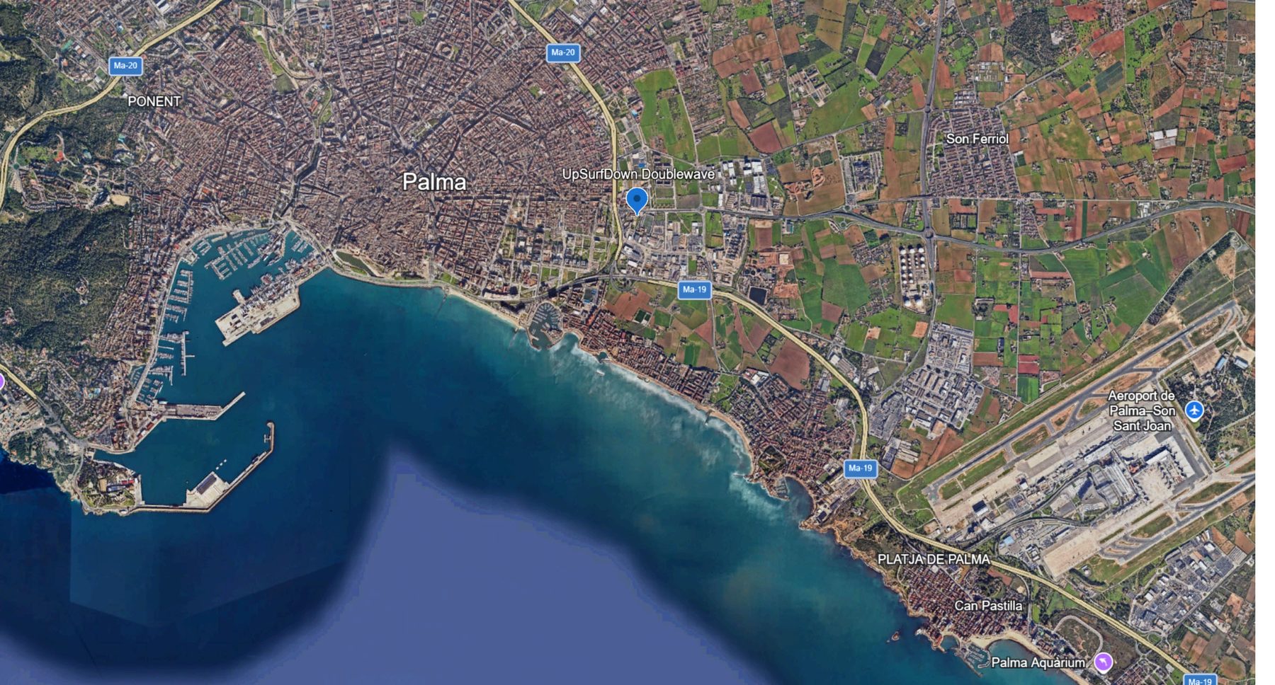 Satellite map of Palma de Mallorca with the UpSurfDown Doublewave site marked inland of the Ma-19, between the old town and the airport.